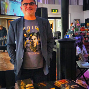 Peter Reposo with his collection of published work.